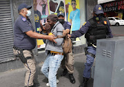 Law enforcement officials dispersed the protesters in Cape Town. 