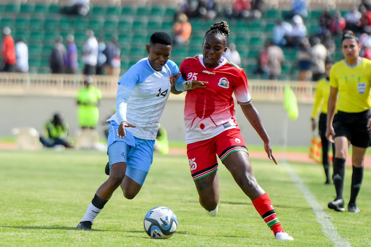 28 and Harambee Starlets Elizabeth Wambui vies for the ball with Botswana's Veronica Mogotsi at Nyayo Stadium on November 29