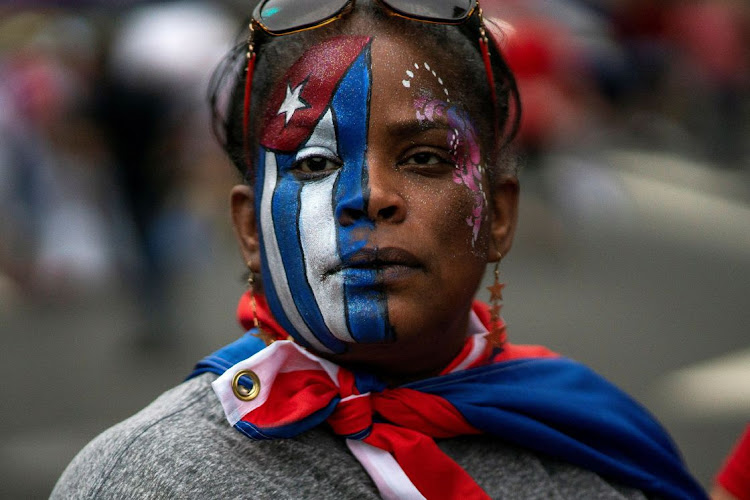 A member of an exiled Cuban community attends a march as the community reacts to reports of protests in Cuba against the deteriorating economy, in North Bergen, New Jersey, the US, on July 13 2021. Picture: REUTERS/EDUARDO MUNOZ