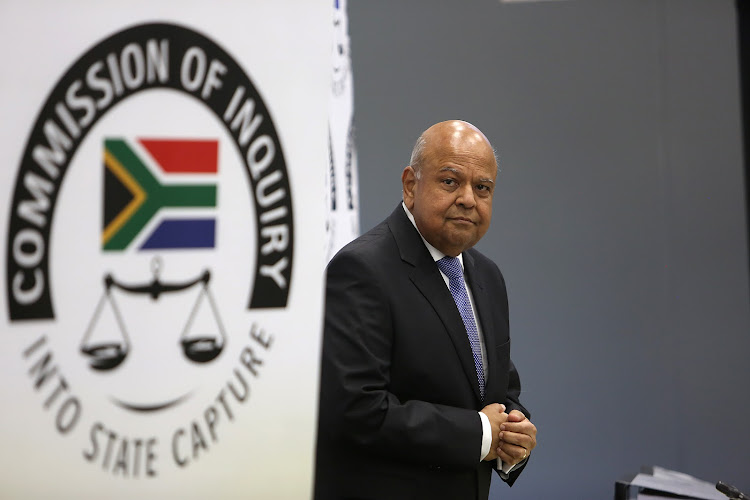 Public enterprises minister Pravin Gordhan told the state capture inquiry that fake news is spread by elites or small groups of people to defend their largesse, or access to their largesse.