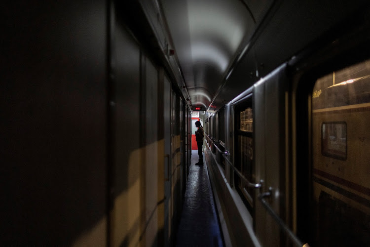 Nehir Karan waits for a neighbour to open their cabin at Iskenderun train station, where train carriages have been turned into temporary shelters for victims of the recent deadly earthquake, in Iskenderun, Turkey, on February 18 2023. Picture: REUTERS/ELOISA LOPEZ