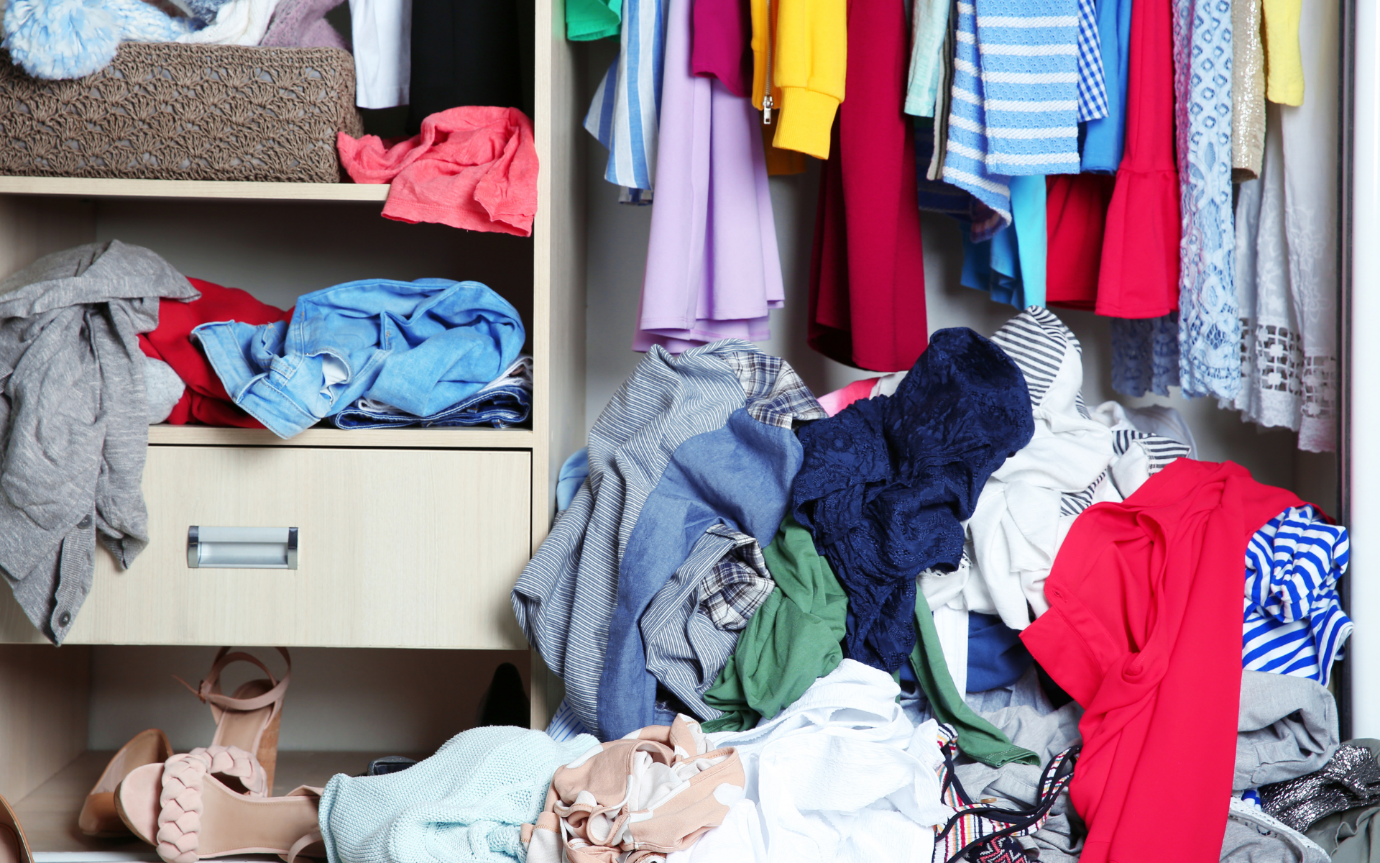 A closet full of clothesDescription automatically generated with medium confidence