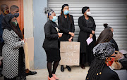 Family and friends attend the funeral service of Tshegofatso Pule in Meadowlands, Soweto.