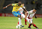 Hlompho Kekana, seen here  challenged by Amin Tighazoui of Wydad, will restart their CAF Champions League campaign against Horoya in Guinea tomorrow. 