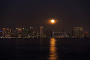 A super moon, known as the Blue Moon, rises above the city of San Diego, California, US, August 30, 2023. 