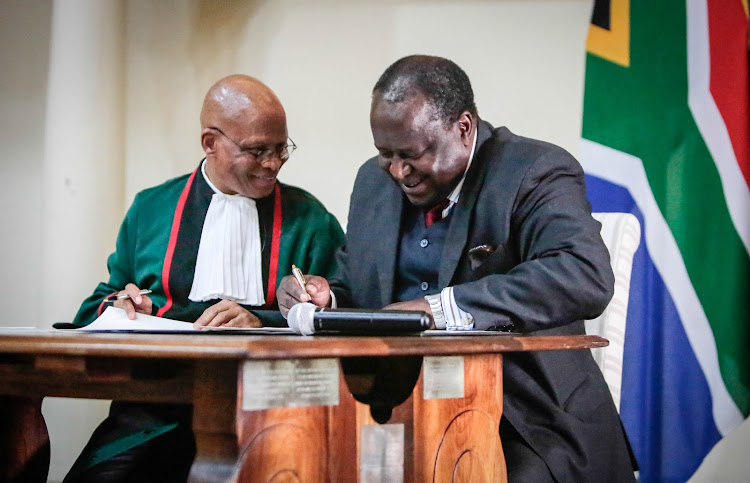 Chief Justice Mogoeng Mogoeng swears in Tito Mboweni as Minister of Finance.