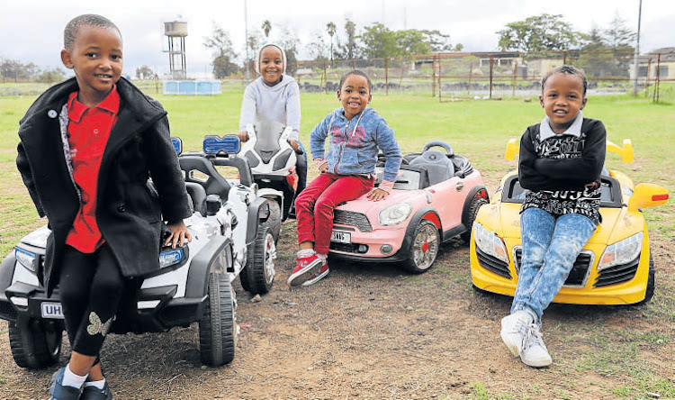 From left, Sese Mbhem, Lizalise Mpevana, None Khosi and Avu Swartbooi stand in front of the toy cars at the Baby Swag playground in Zwelitsha.