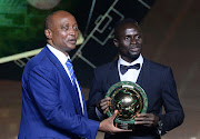 Sadio Mané (Senegal and Bayern Munich) receives the African Player of the Year Award from Confederation of African Football president Patrice Motsepe during the 2022 Caf Awards at Mohammed VI Complex in Morocco on July 21.