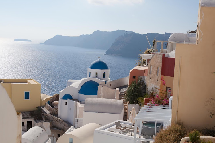 Rooftops and iconic Cycladic architecture in Oia on the Greek island of Santorini. 