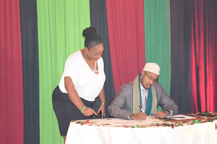 Officials from IEBC, Kenya Editors Guild and Kenya Union of Journalists during the signing of the Results Transmission Protocol and Media guidelines on Monday, July 19, 2022.