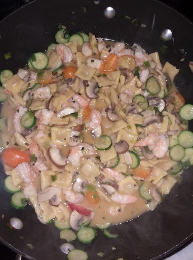 Pasta with seafood and veggies in a light butter sauce