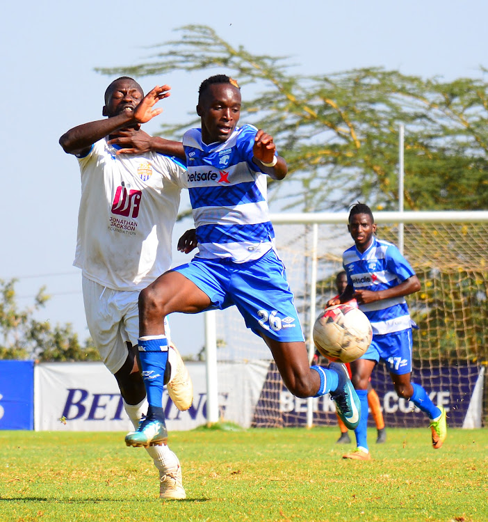 AFC Leopards' Marvin Nabwire shields the ball from Peter Opiyo of City stars during their premier league match at Kasarani.