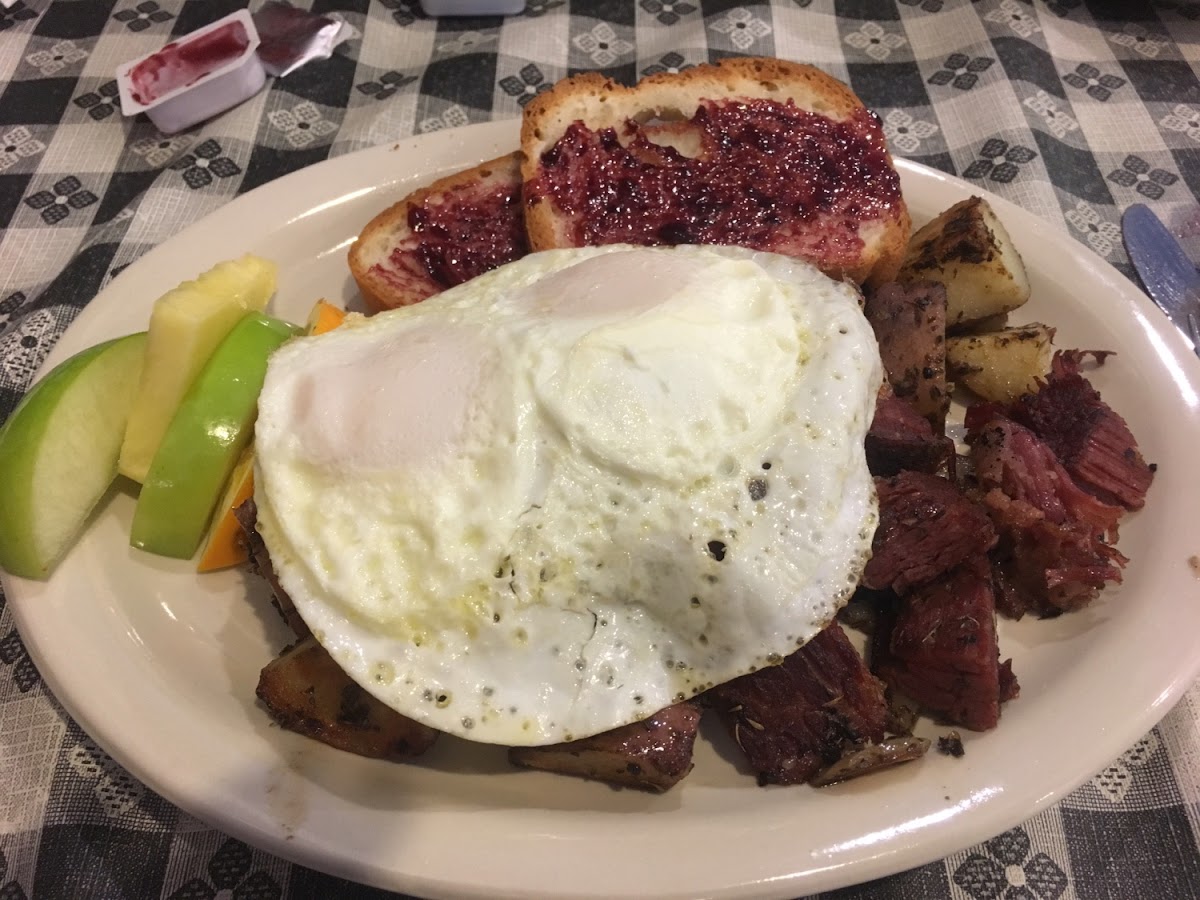 GF slow cooked corn beef hash with over easy eggs.