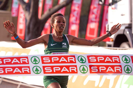 Ethiopian runner Tadu Nare crosses the finish line in the Spar 10km Women's Challenge Grand Prix race in Durban on Saturday.