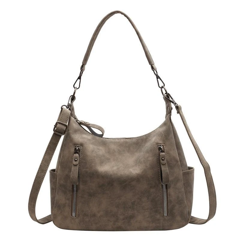 Sac à bandoulière femme en PU souple, rétro et simple. Idéal pour un usage quotidien, alliant confort et élégance.