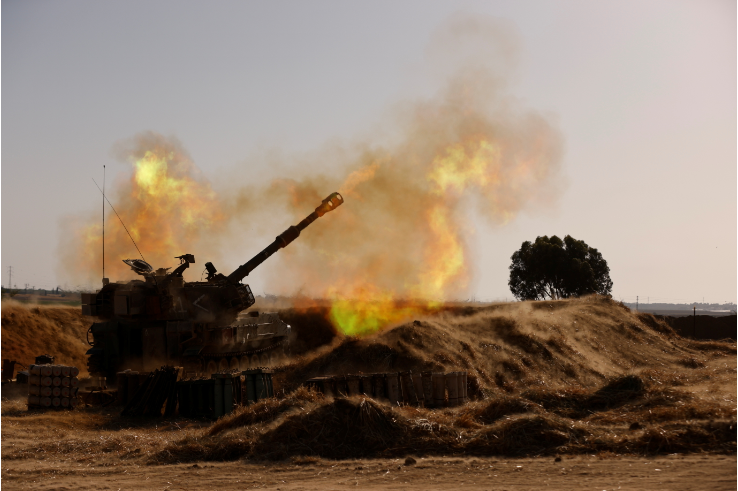 An Israeli mobile artillery unit fires near the border between Israel and the Gaza Strip, on May 12 2021.