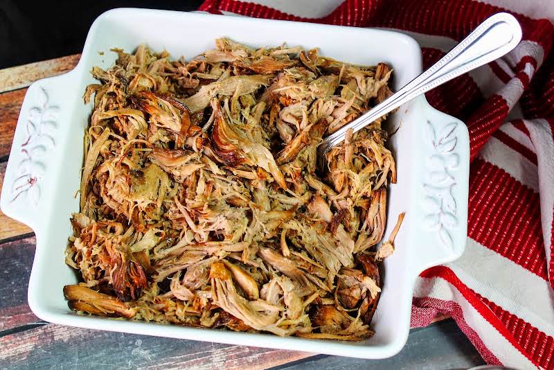 Pork Shredded After Cooked In The Slow Cooker.