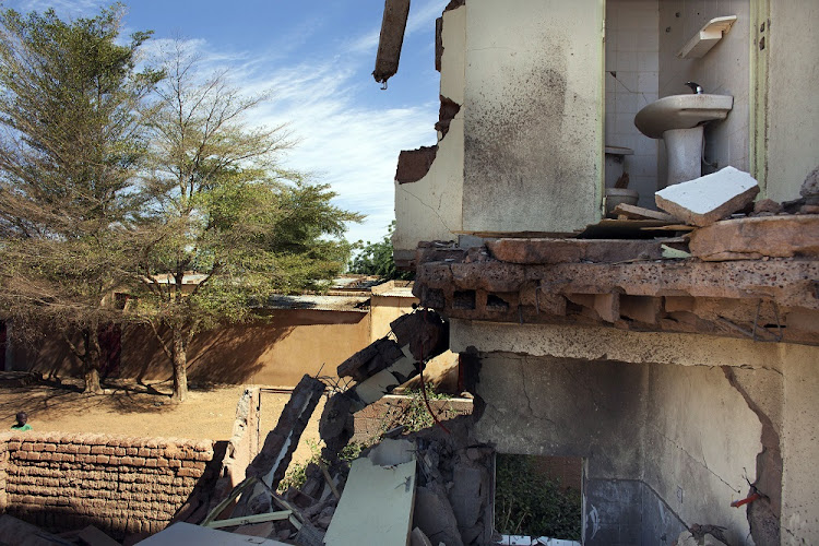 The remains of a hotel hit by French air strikes are seen in Douentza January 29, 2013. The hotel was used as a base for Islamists and was hit by French air strikes. File photo