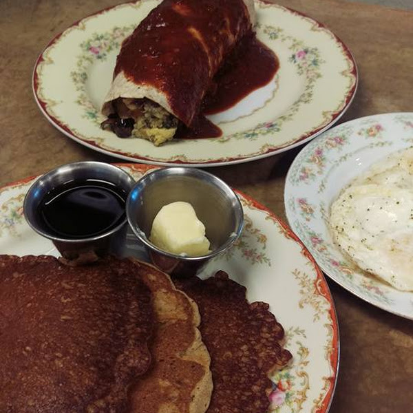 Banana Buckwheat Pancakes with real butter and maple syrup as well as Breakfast Burrito with red sauce.