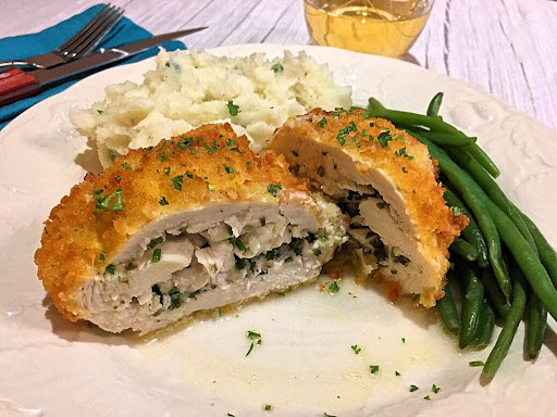 A nice breaded chicken breast stuffed with garlic butter.