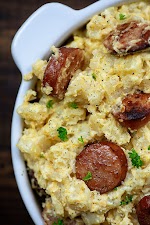 Slow Cooker Cheesy Potatoes and Smoked Sausage was pinched from <a href="https://www.bunsinmyoven.com/crockpot-cheesy-potatoes-and-smoked-sausage/" target="_blank" rel="noopener">www.bunsinmyoven.com.</a>