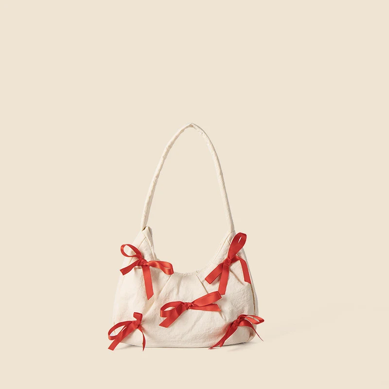 Bolsa feminina de nylon com laço moderna, ideal para uso diário. Leve seus pertences com estilo e praticidade, um acessório perfeito.