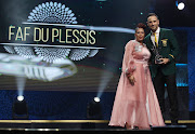 Faf du Plessis of South Africa receives Standard Bank One-Day International Cricketer of the Year award from Desiree Pooe, Head of Sponsorship at Standard Bank during the Cricket South Africa Awards at the Sun Square Arena in Pretoria on August 3 2019. 