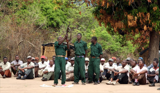 Fighters of former Mozambican rebel movement "Renamo" receive military training on November 8, 2012 in Gorongosa's mountains, Mozambique. Former rebel leader turned opposition party chief, Afonso Dhlakama, twenty years after agreeing to peace, is ready to take up weapons again unless the ruling Frelimo party agrees to renegotiate peace terms. Renamo waged a16-year civil war against Frelimo that devastated the economy until peace was signed in 1992. File photo