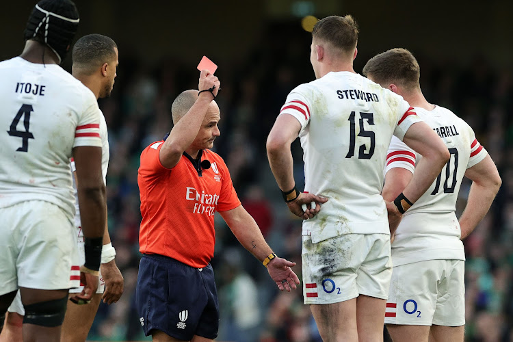 Referee Jaco Peyper shows Freddie Steward of England a red card during the Six Nations match against Ireland at Aviva Stadium on March 18, 2023 in Dublin