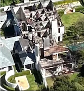 An aerial view of one of the northern suburb homes allegedly targeted by a lone arsonist.