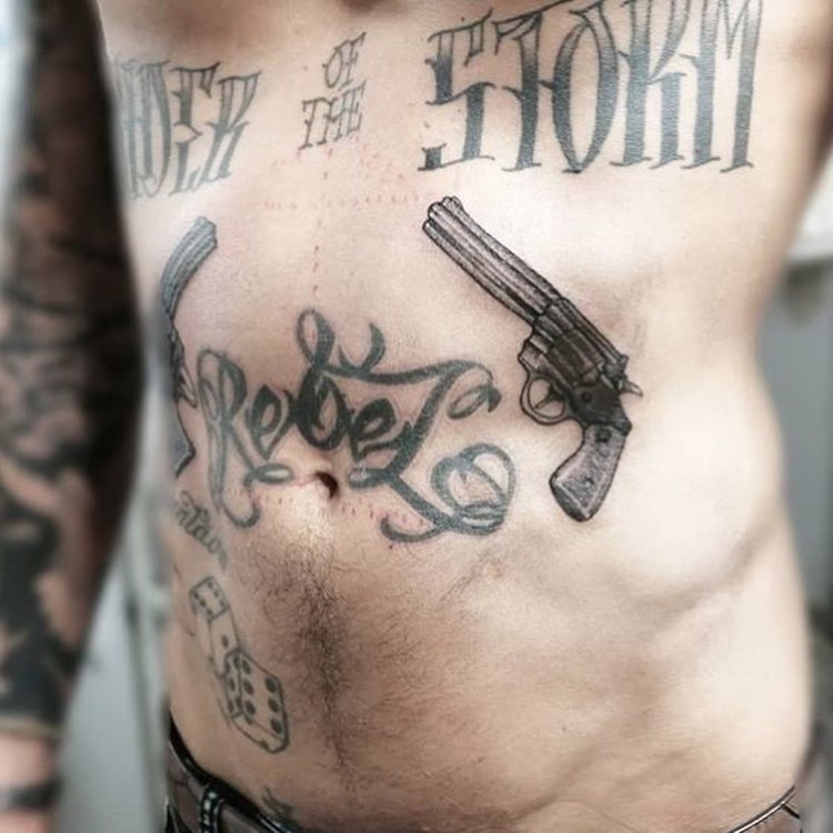 Rebel Gun Tattoo On Waist