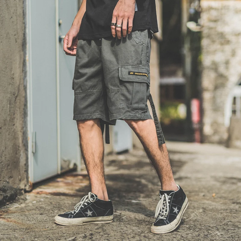 Combinaison d'été décontractée pour homme, ample, cinq points, parfaite pour la chaleur. Confort et style assurés. Idéale pour les journées d'été et les sorties.