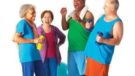 group of elderly people in gym clothes laughing