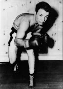 American contender for Middleweight title, Jake La Motta, in training to meet Marcel Cerdan, the French middleweight champion at Detroit. La Motta, also known as The Raging Bull, was born on July 10, 1922 in The Bornx, New York. He died aged 95 from complications of pneumonia in a nursing home in Florida on September 19, 2017. 