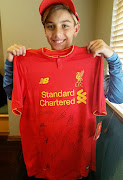 Jordan van der Westhuizen with his signed Liverpool jersey 