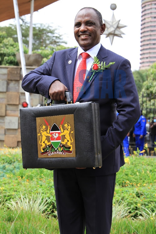 Treasury CS Ukur Yatani poses for a photo at Parliament Buildings ahead of reading the Budget on June10