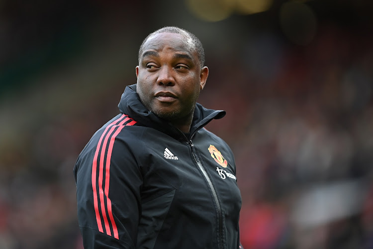 Manchester United first team coach Benni McCarthy looks on ahead of the FA Cup quarterfinal against Fulham at Old Trafford on March 19 2023.