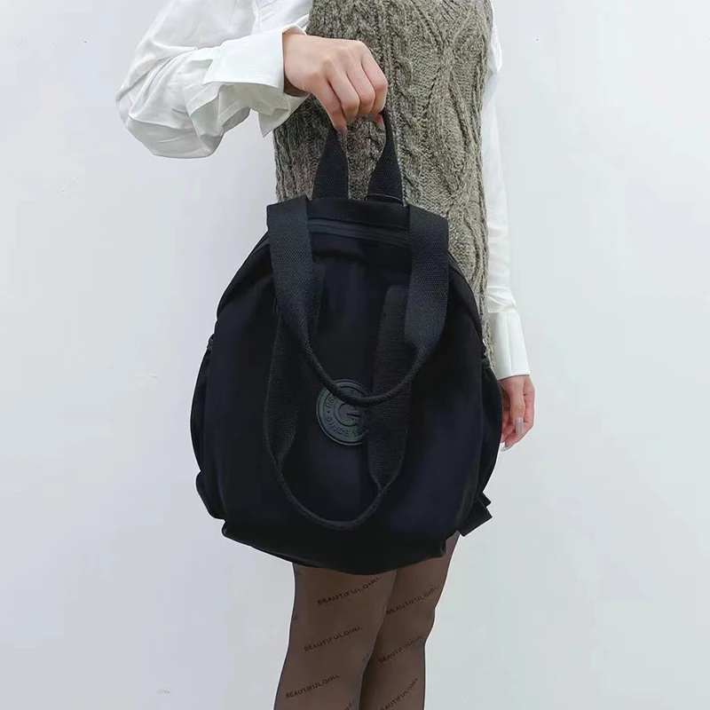 Bolsa Redonda Preta Feminina Grande Capacidade Mochila Ombro Mão Multifuncional Fashion para o Dia a Dia e Viagens