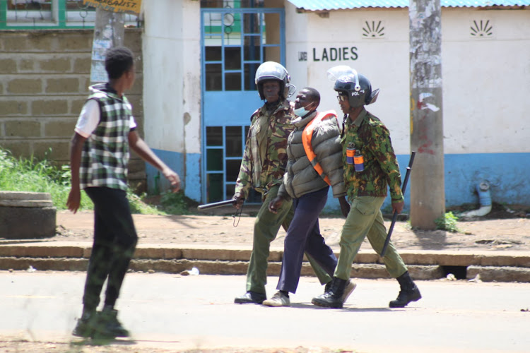 Police officers arrest a boda boda operator spotted provoking police during Azimio protests in Kisumu on May 2, 2023.