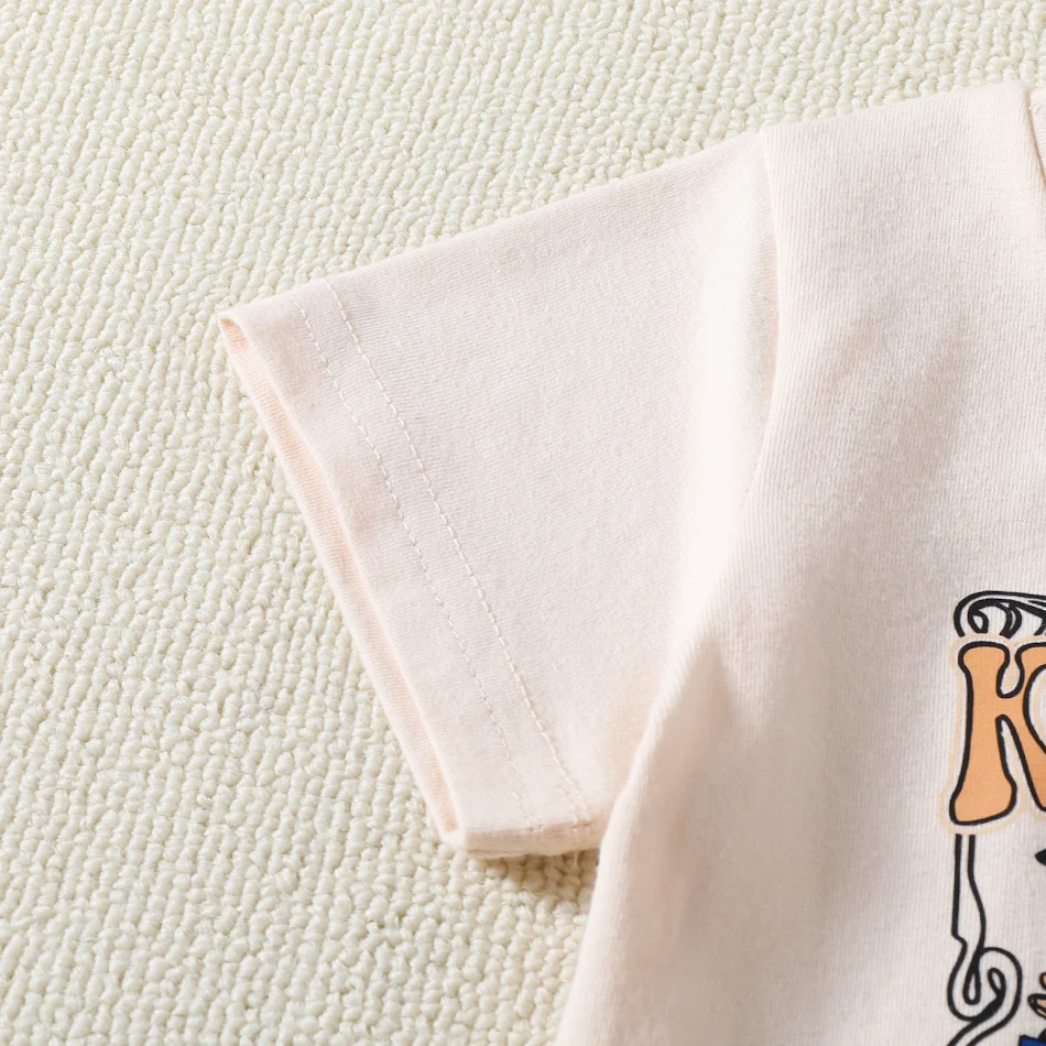 Ensemble d'été pour enfants à imprimé floral, haut à manches courtes et pantalon à pattes d'éléphant, parfait pour les journées ensoleillées.