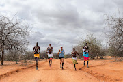 Mina Guli, founder and CEO of Thirst Foundation, running marathon number 48 with Samburu warriors in Kenya during the Run Blue campaign to raise awareness, create urgency and drive action on water. 