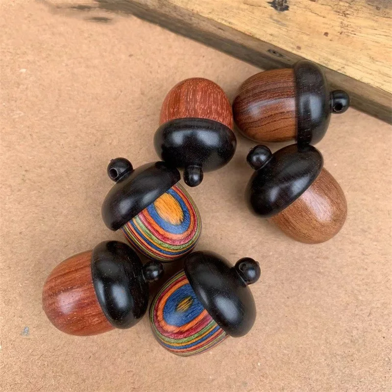 Ebony Blood Sandalwood Unscrew Pendant with Pine Nuts and Hazelnut, a unique, natural aromatic accessory.