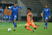 Thabo Mnyamane of SuperSport United (L) is tackled by Marcel Kalonda of Zesco United during the CAF Confederation Cup match  at Lucas Moripe Stadium on September 15, 2017 in Pretoria, South Africa. 