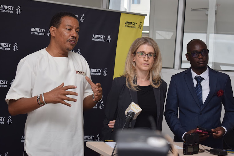 Amnesty International Kenya executive director Houghton Irungu, regional director Sarah Jackson and executive officer Elvis Salaton during the launch of Amnesty International Report 2021-22 on March 30, 2022