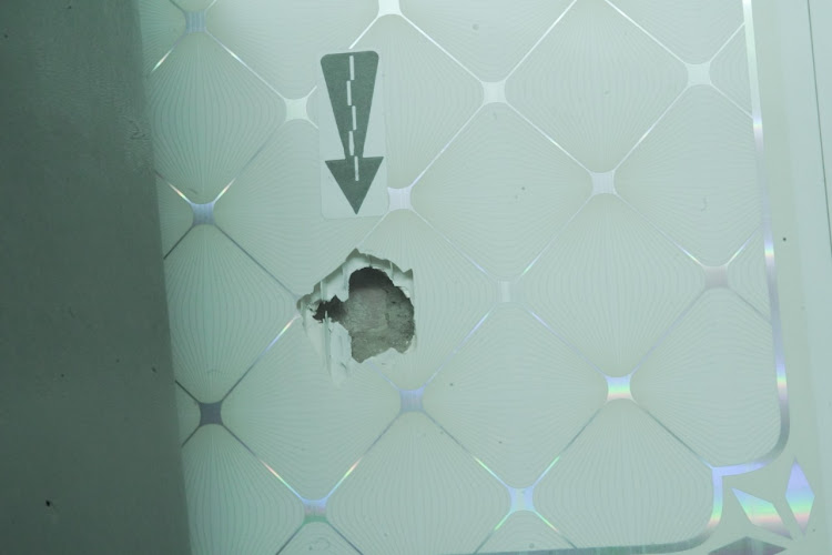 A bullet hole in the Laudium barber shop.