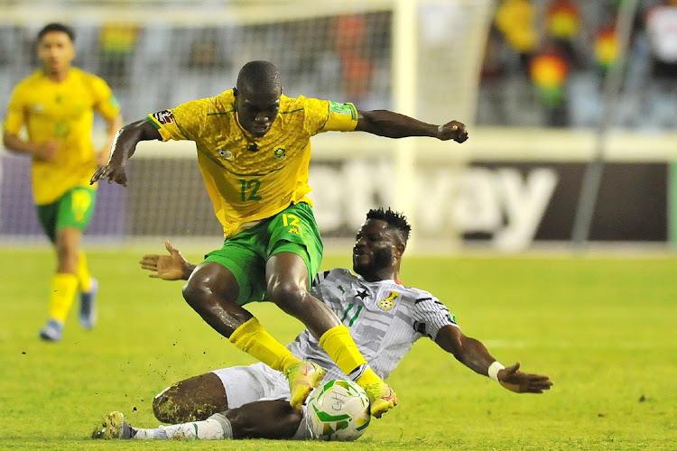 Bongokuhle Hlongwane of South Africa is challenged by Mubarak Wakaso of Ghana during the Qatar 2022 Fifa World Cup qualifier between Ghana and South Africa in Cape Coast, Ghana, on November 14 2021. Picture; BACKPAGEPIX/THABANG LEPULE