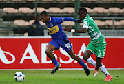 Craig Martin of Cape Town City evades challenge from Ronald Pfumbidzai of Bloemfontein Celtic during the Absa Premiership 2017/18 football match between Cape Town City FC and Bloemfontein Celtic at Athlone Stadium, Cape Town on 17 October 2017.