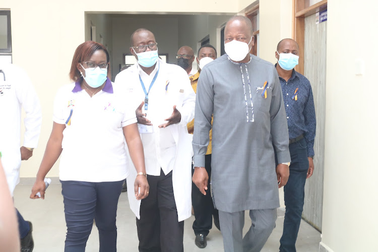 Health CS Mutahi Kagwe with county health officials during a tour of the new cancer treatment center at the CGTRH on Friday,