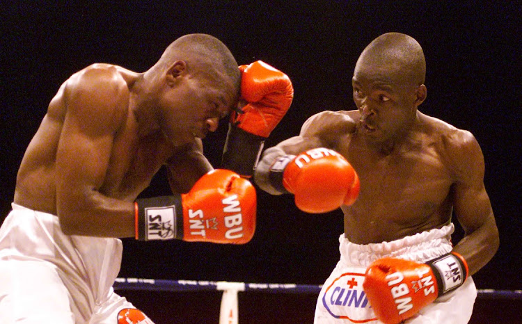 Lehlohonolo Ledwaba, right, hands out punishment to Vuyani Bungu.