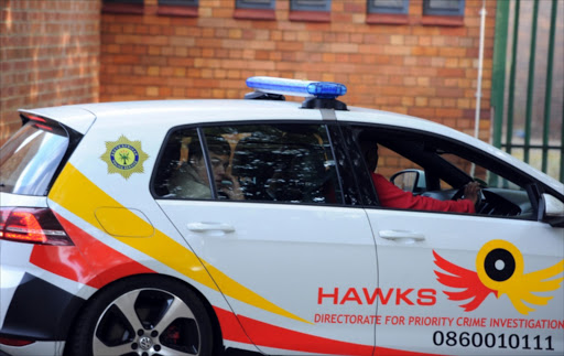 The Hawks car during Miela Jansen van Vuuren, Cor Loggenberg and Loedie van der Westhuizen's appearance at the Parys Magistrate Court on May 26, 2016 in Parys, South Africa.